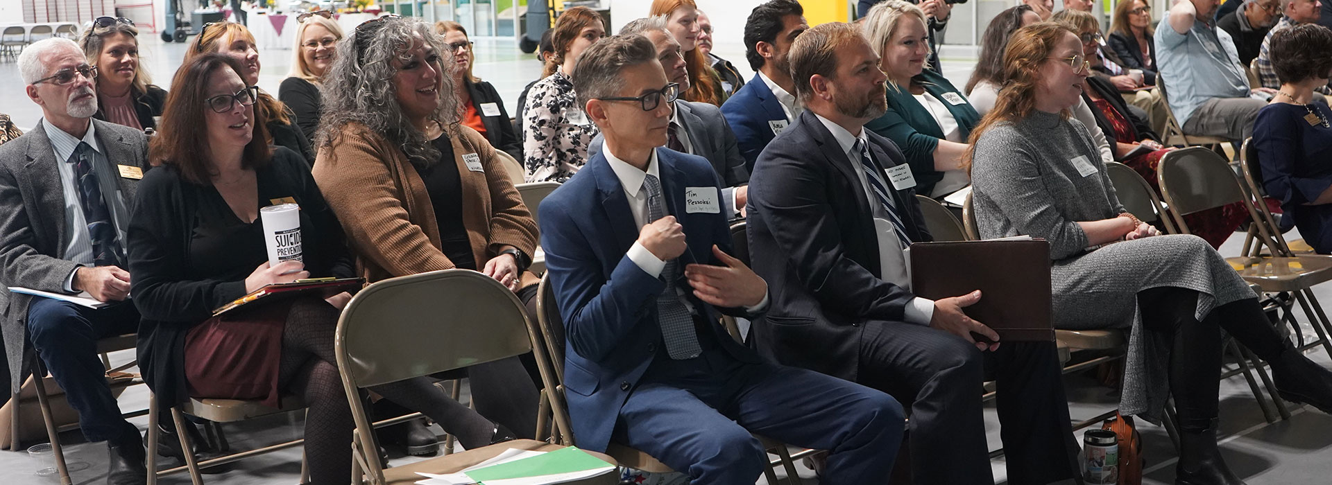 Faculty, staff and community members attend a past advisory board event.