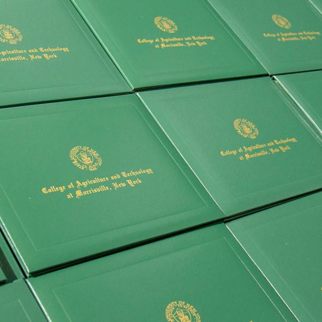 Diploma covers laid out for Commencement