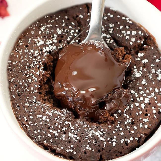 Spoon dipping into chocolate lava cake