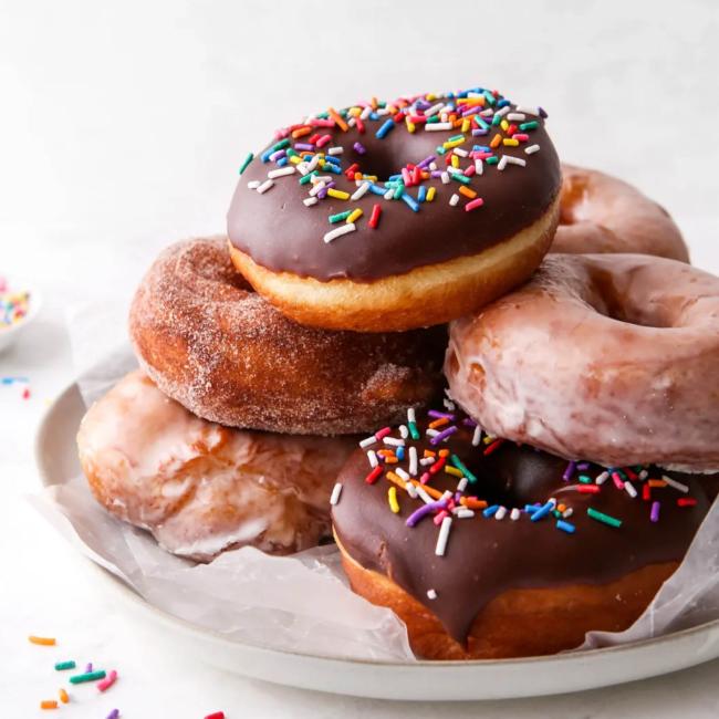 Stack of donuts on a white plate